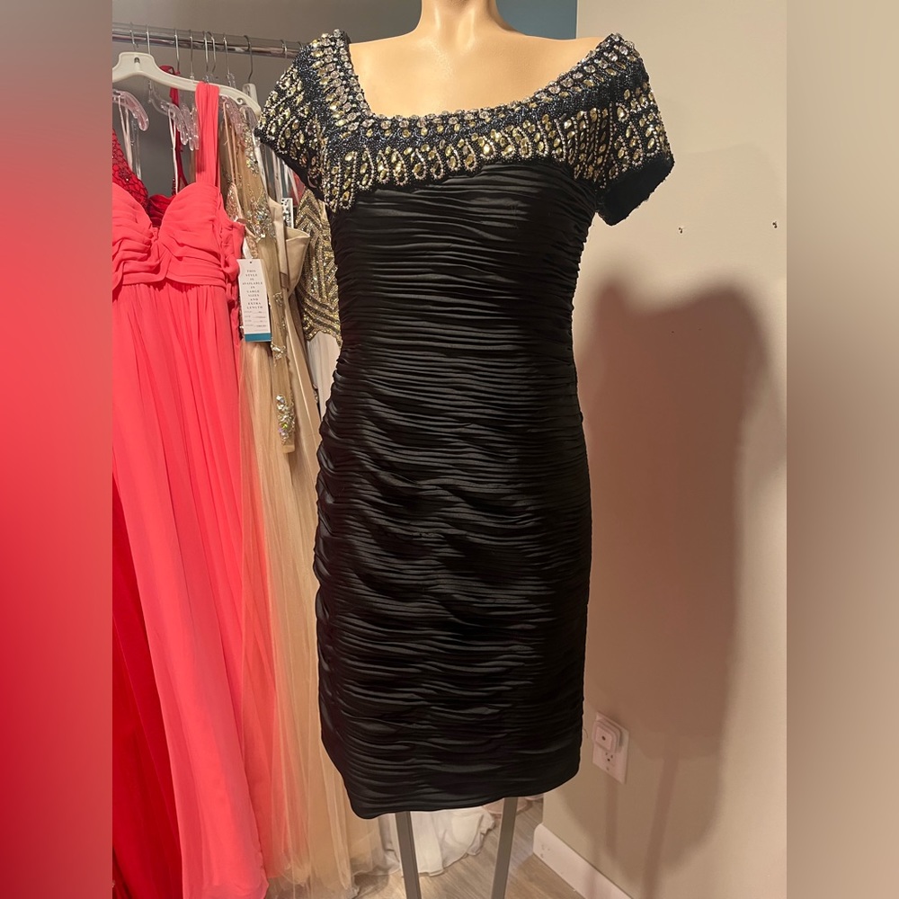 Terani Couture. Size 8 dress. Black with beaded/gem top.